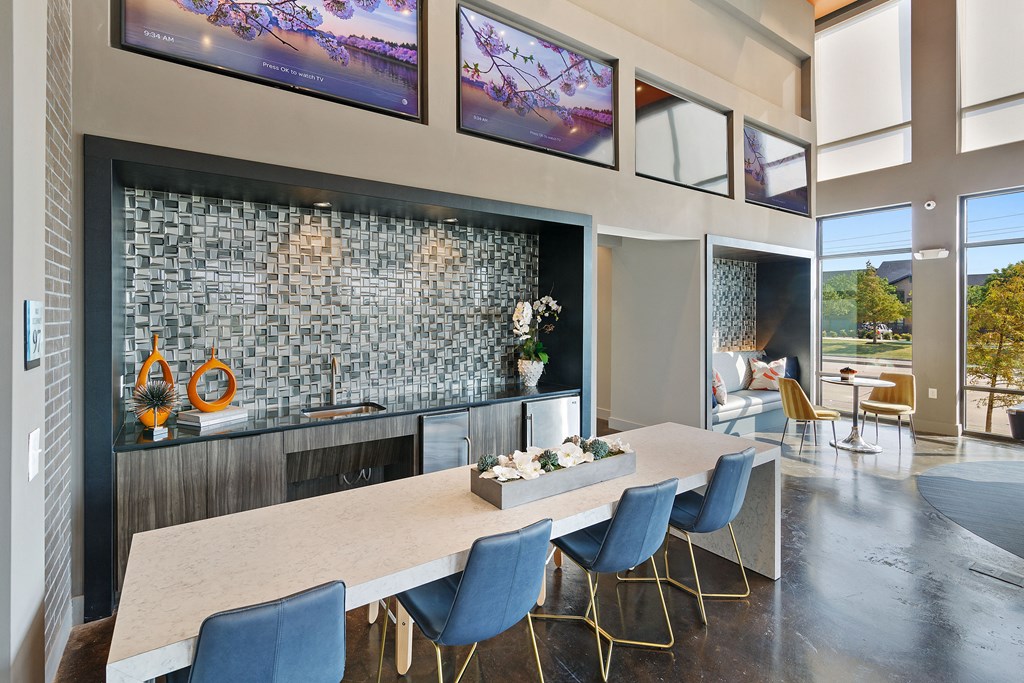 a dining room with a long table and chairs and a fireplace
