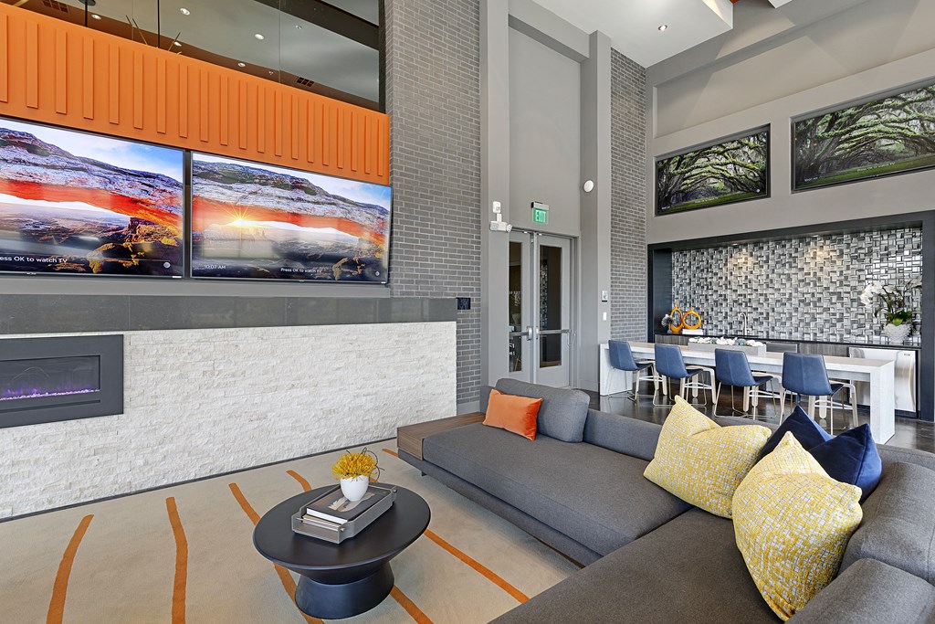 a rendering of a lobby with couches and a coffee table