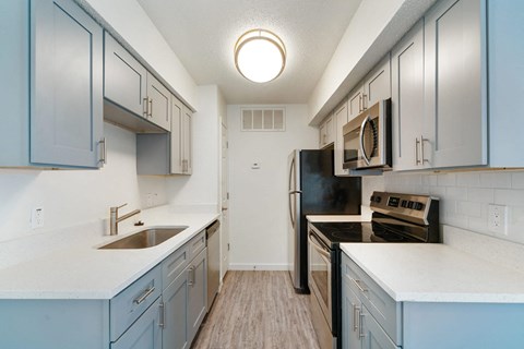 the preserve at ballantyne commons apartment kitchen with stainless steel appliances