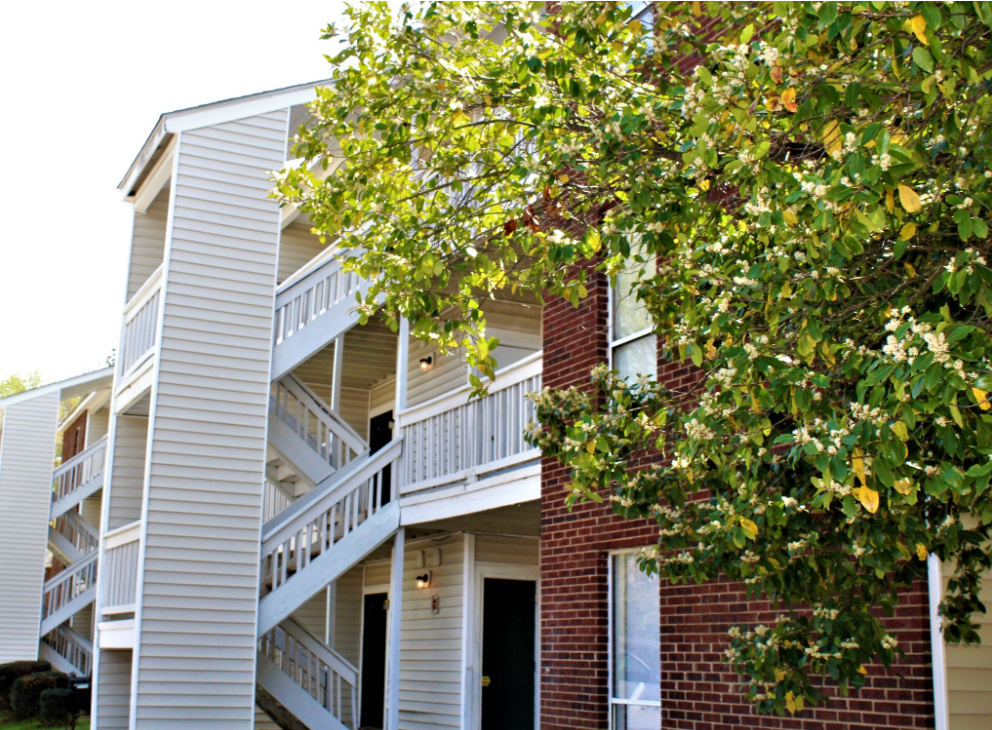 a building with a tree in front of it
