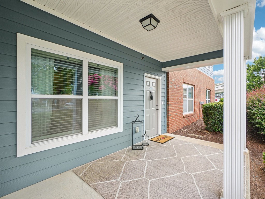 A house with a blue wall and a white door.