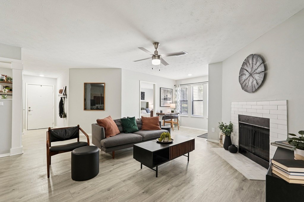 A living room with a fireplace and a couch.