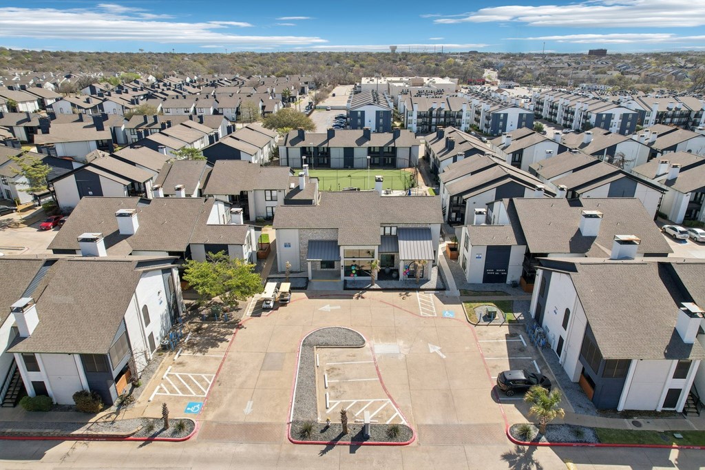 A residential area with houses and a basketball court.