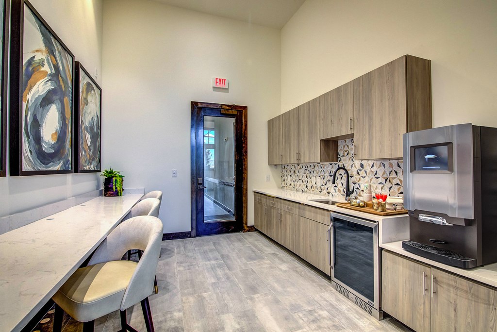 a kitchen with a refrigerator freezer and a sink