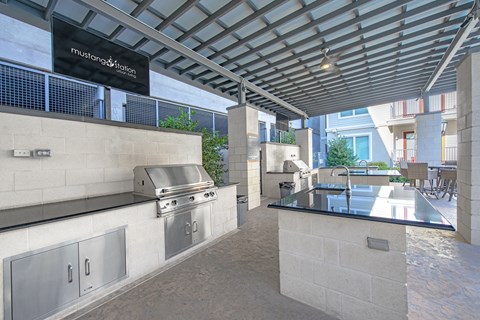 a kitchen with a large counter and a sink in a building
