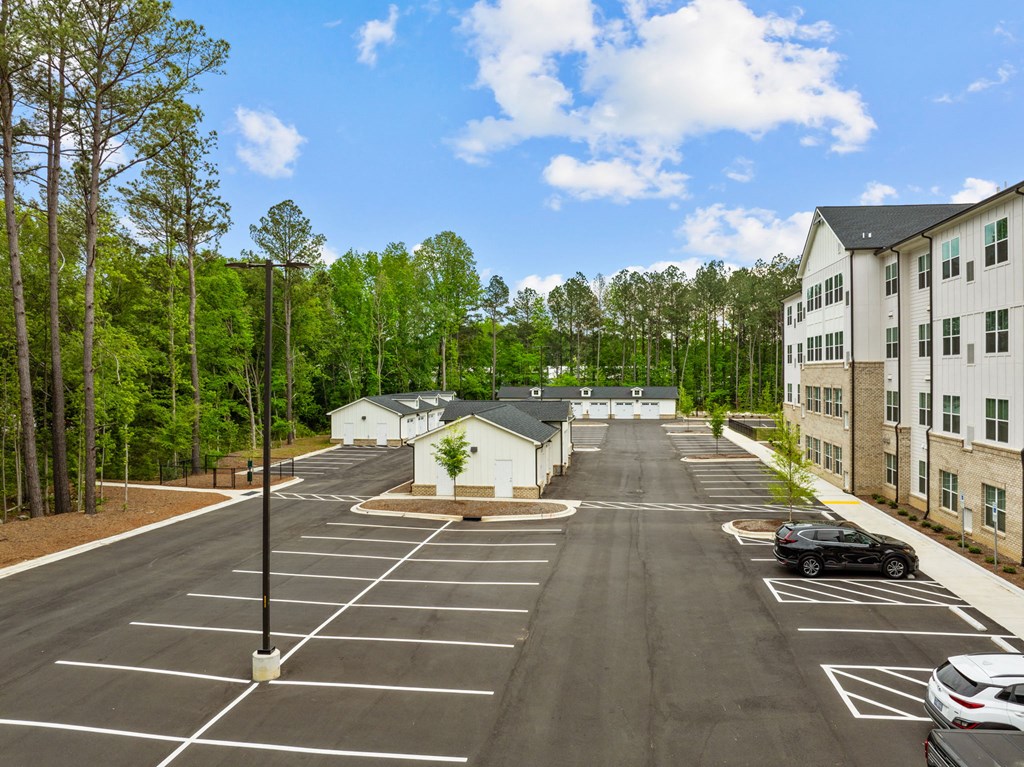 an empty parking lot at an apartment complex