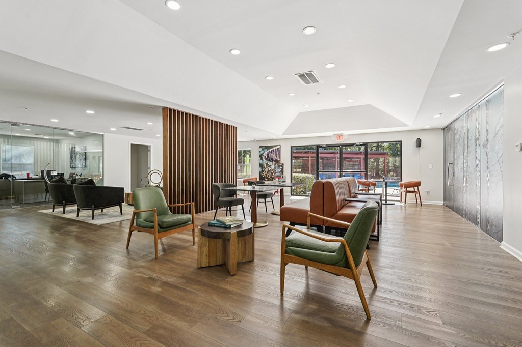 A room with wooden floors and furniture.