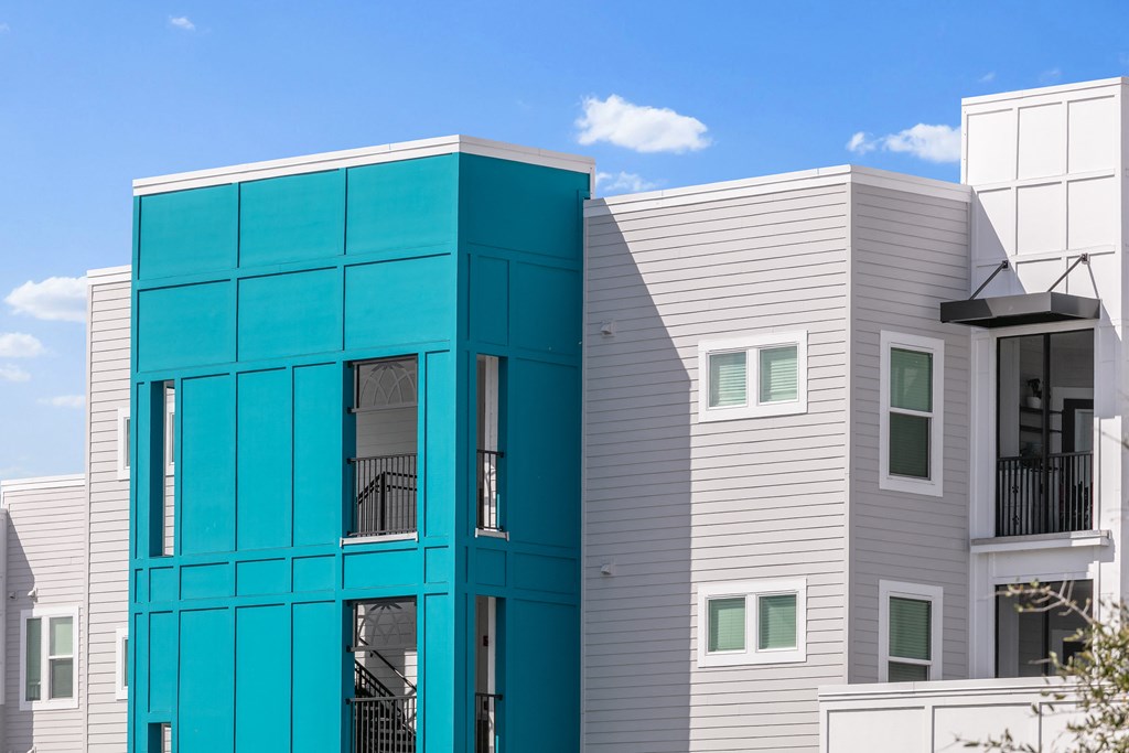 A modern building with a blue and white facade.