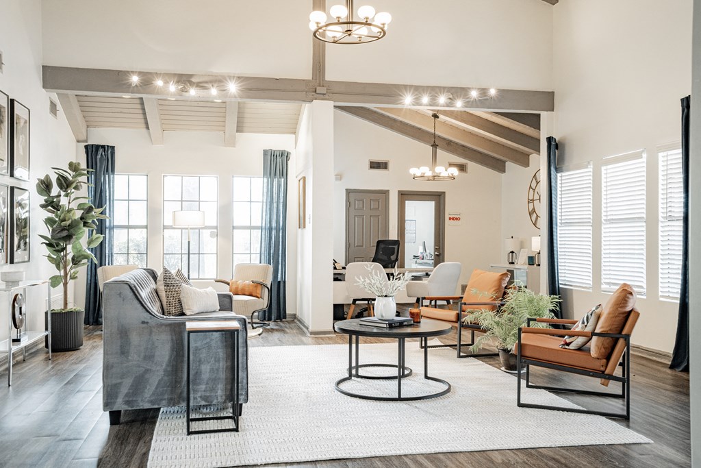 a living room with couches and chairs
