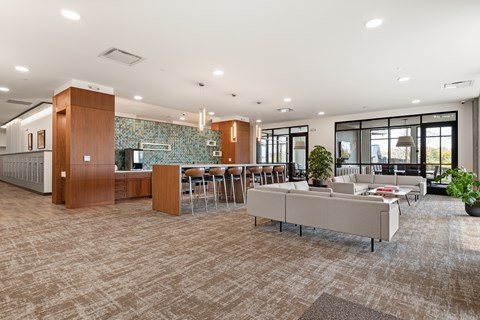 A modern office space with a long table and chairs.