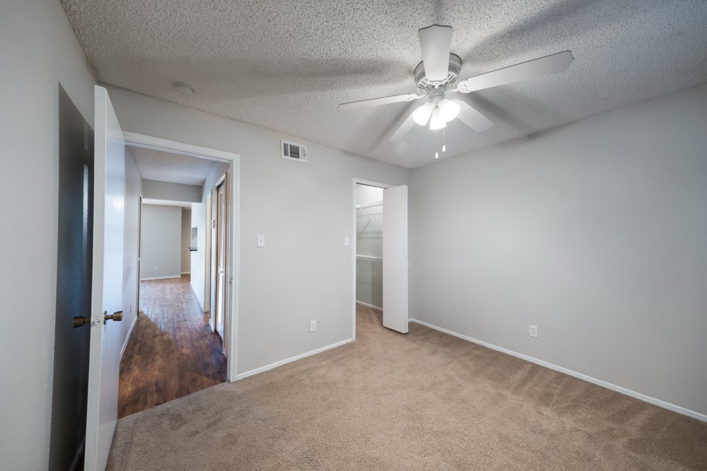 carpet room with hardwood hallways