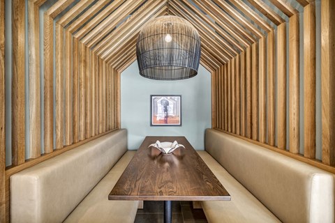 a dining room with a wooden table and a chandelier
