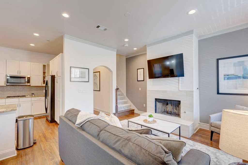 a living room with a couch and a fireplace