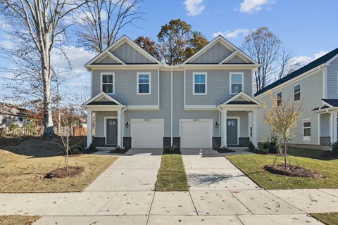 A two-story house with a grey and white exterior.