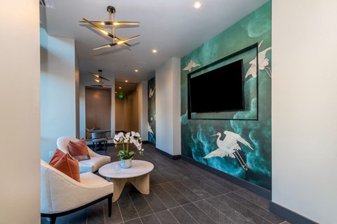 a living room with a large painting of a crane