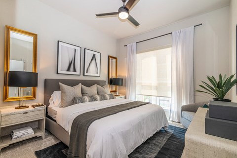 a bedroom with a large bed and a window