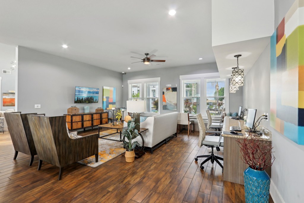 A modern office space with wooden floors and white walls.