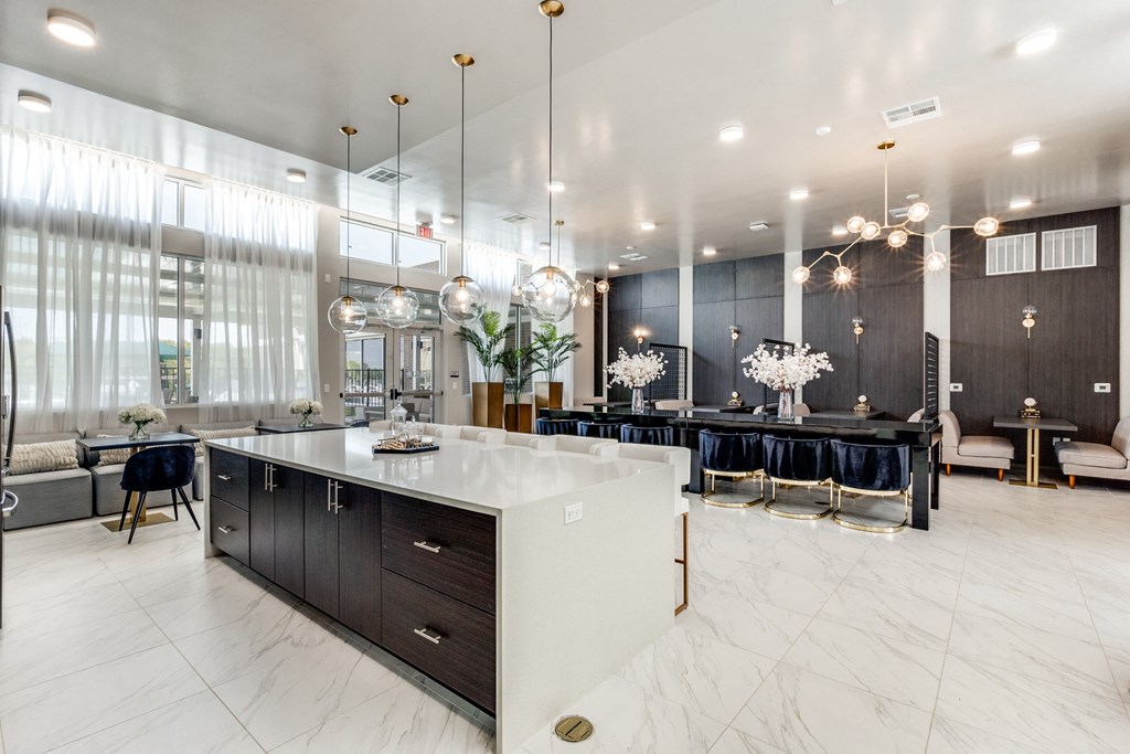 a kitchen with a large island and a bar