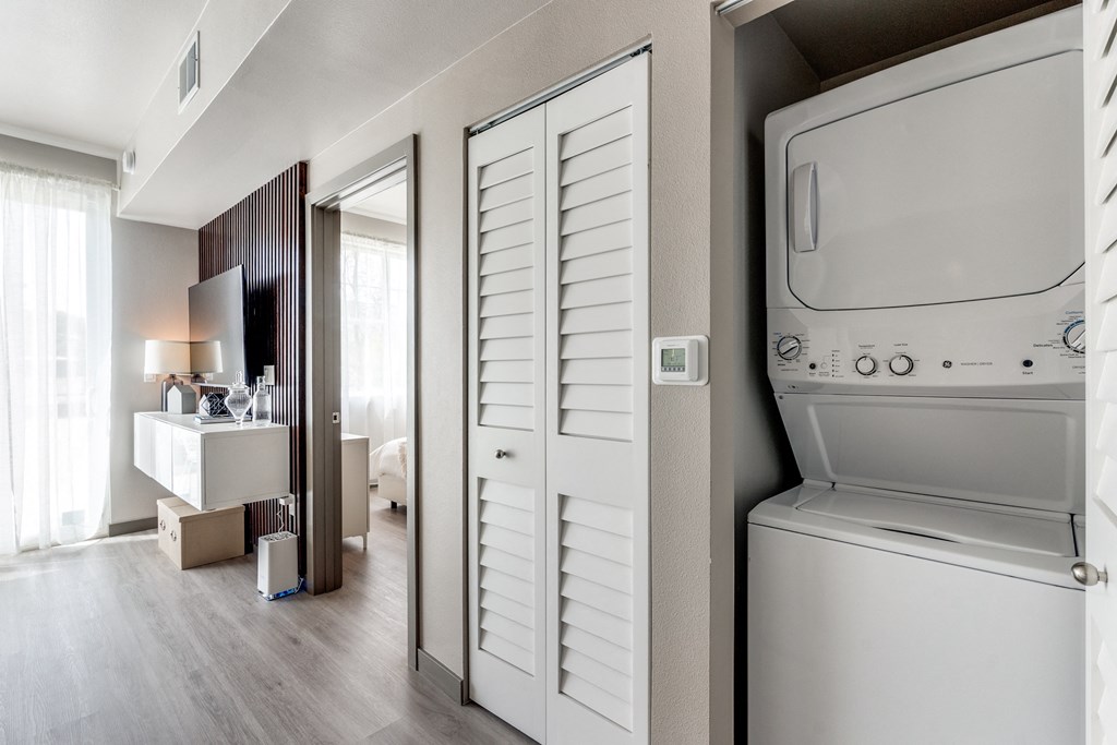 a room with a washer and dryer in it