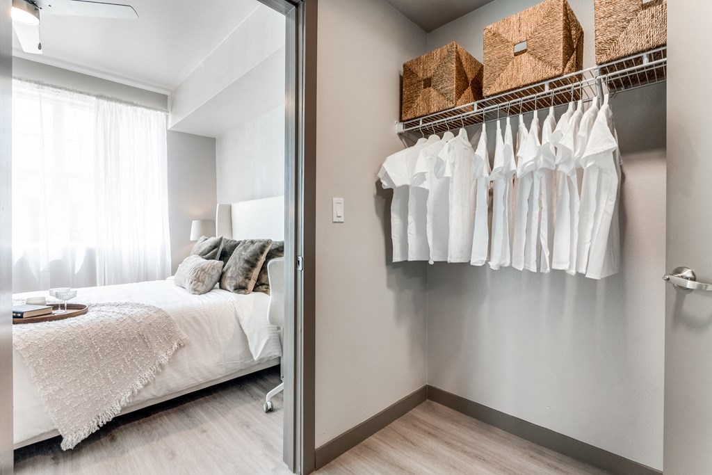 a bedroom with a bed and a mirror