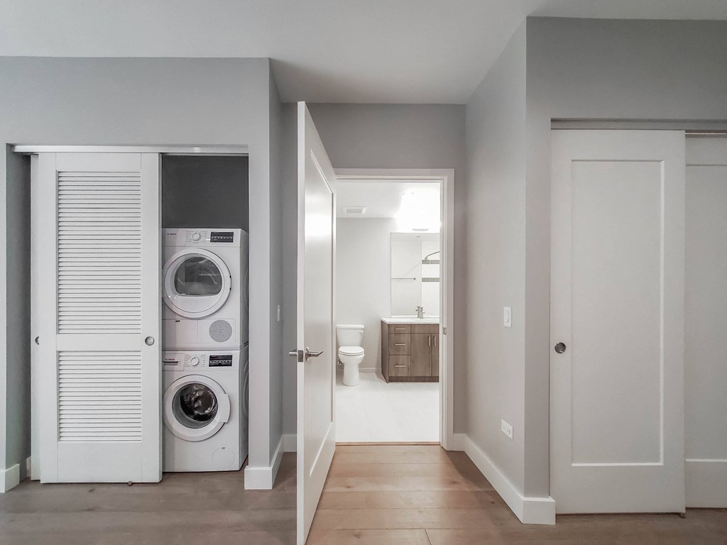 A laundry room with a washer and dryer in it.