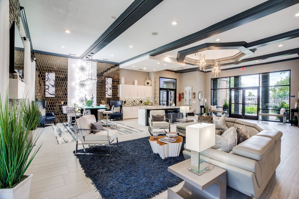 a living room with couches and chairs and a table