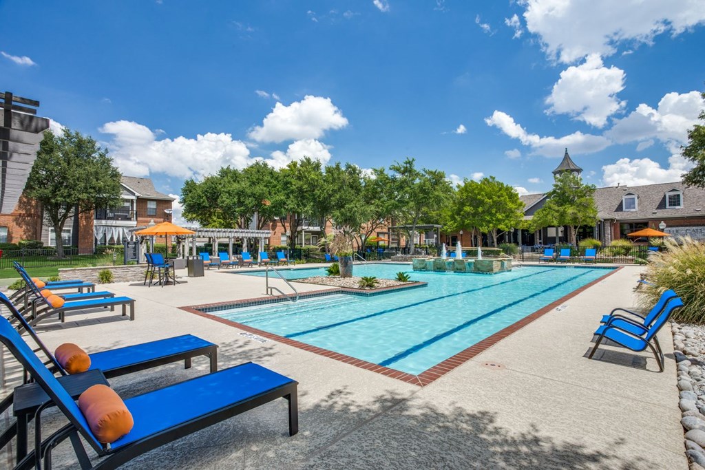 our apartments offer a swimming pool with lounge chairs and umbrellas