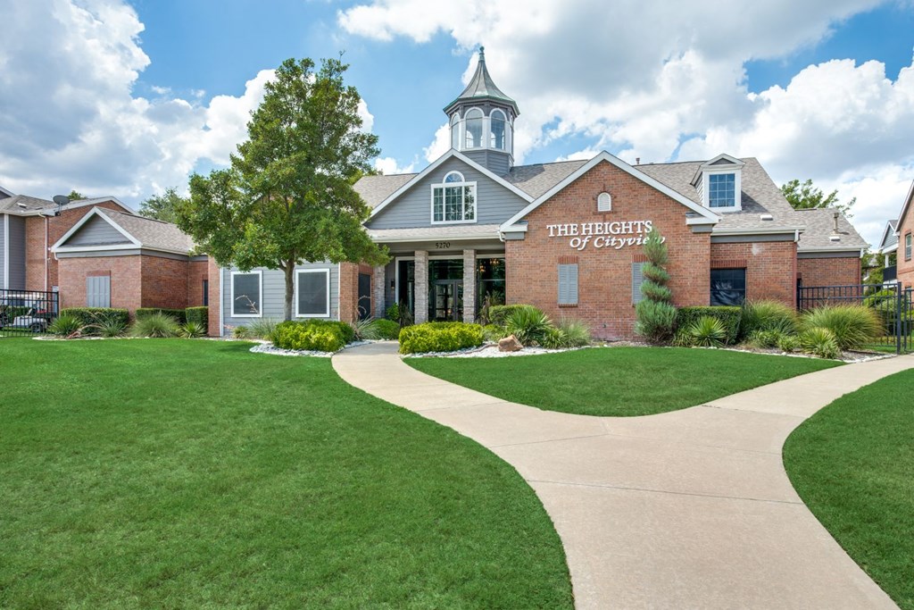 front view of the refreshment of ozarks building with green grass and a sidewalk