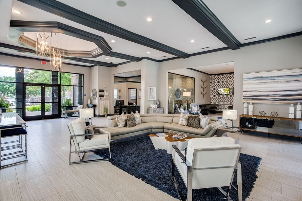 a living room with couches and chairs and a fireplace