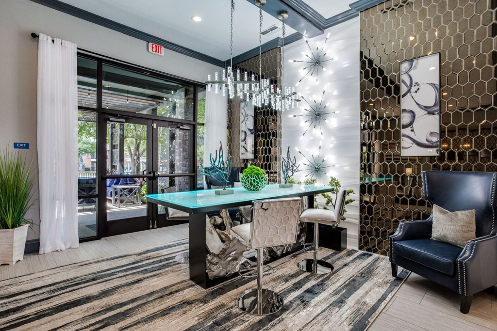 a conference room with a glass desk and chairs