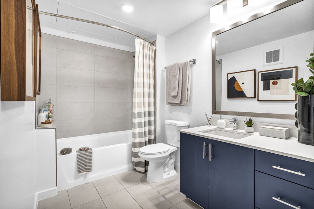 a bathroom with a toilet and a sink in it