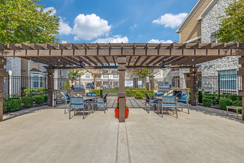 A sunny day at the outdoor seating area of a restaurant or cafe.
