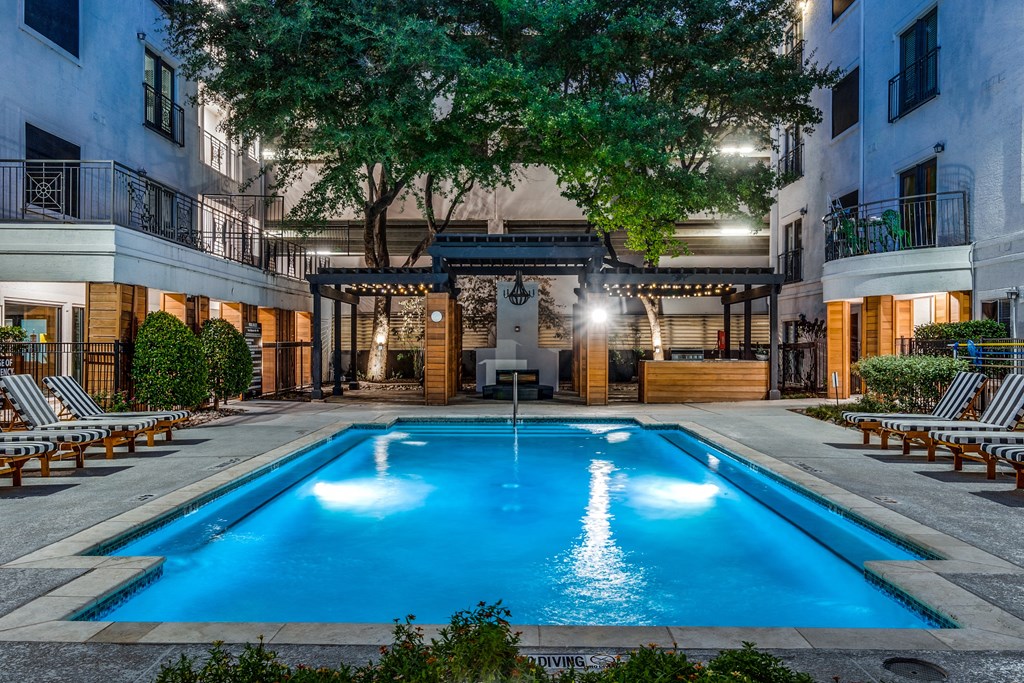 a swimming pool in the middle of an apartment building