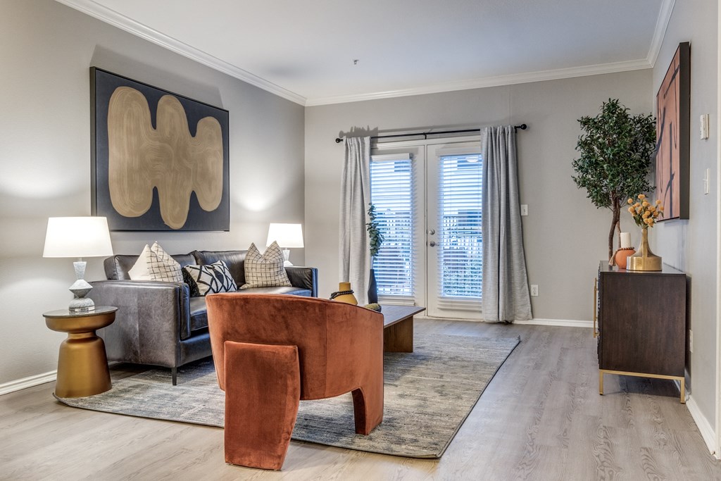 an open living room with a couch and a chair