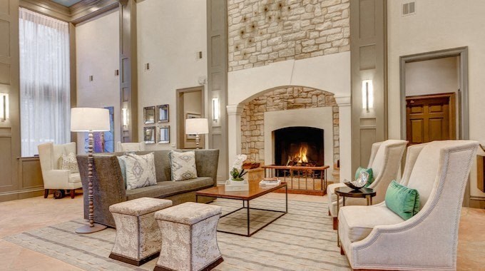 A living room with a fireplace and a couch.