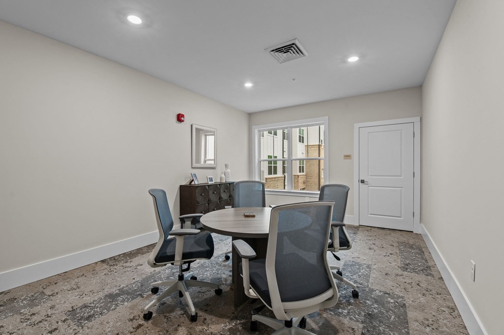 Active Adult conference room with a round table and chairs Active Adult conference room with a round table and chairs