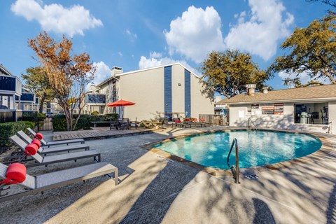 our apartments have a resort style pool and lounge chairs