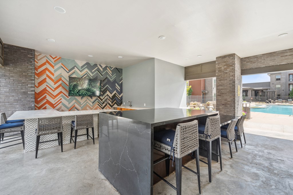 a large kitchen with a large island and a pool