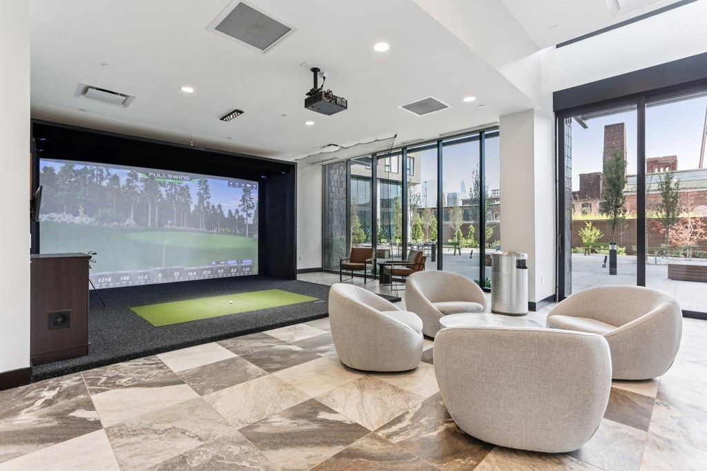 A conference room with a green screen and a view of the outside.