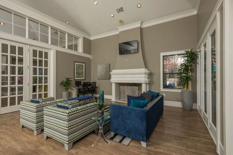 a living room with couches and a fireplace