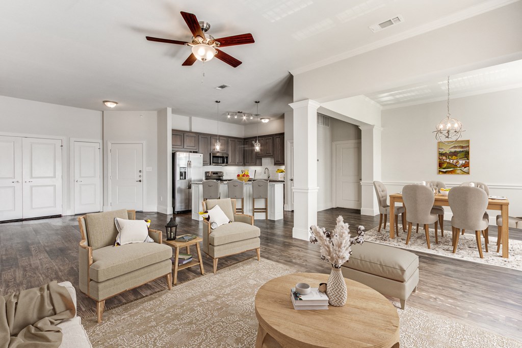 a living room with a dining room and a kitchen