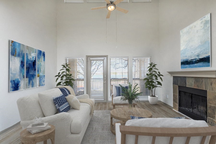 a living room with a white couch and a fireplace