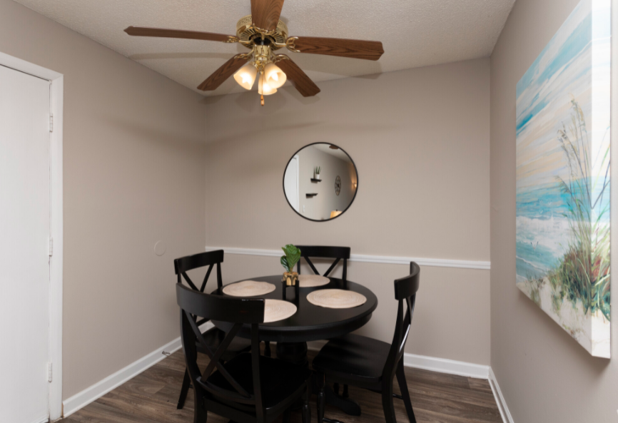 this is a photo of the dining room in a 2 bedroom apartment at deer hill apartments in