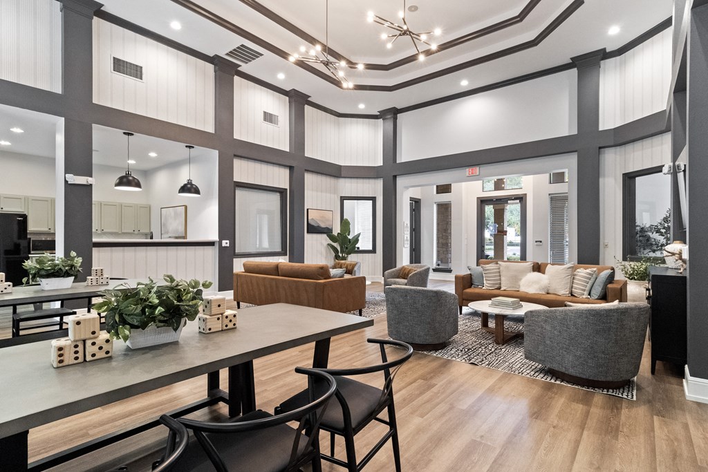 a living room with couches and chairs and a table