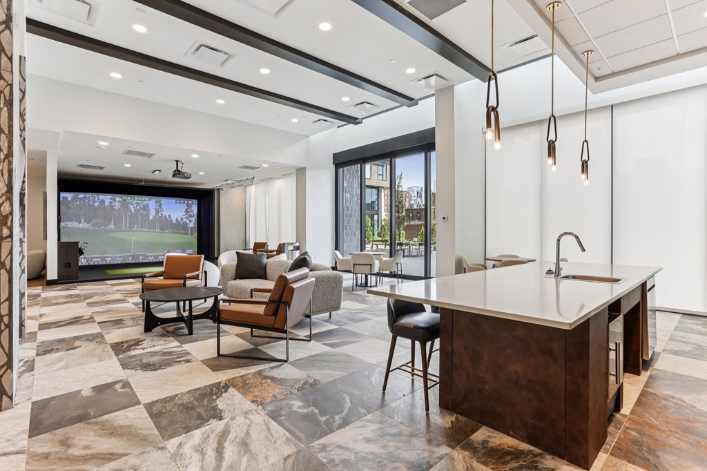 A modern kitchen and living room with a marble floor and a large window.