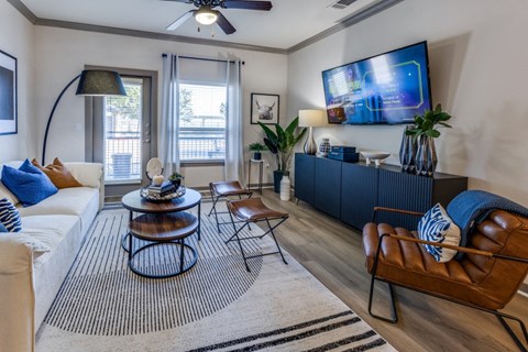 a living room with a couch and a tv