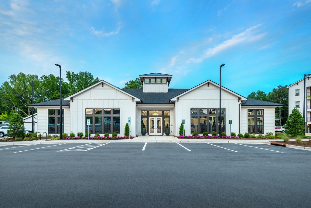 the exterior of a building with a parking lot