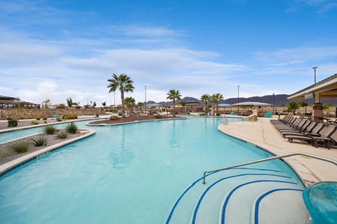 A large swimming pool with a blue tinted water.