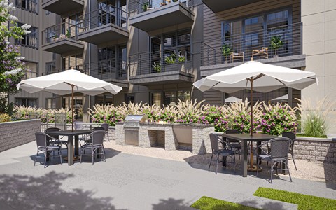 a patio with tables and chairs and umbrellas
