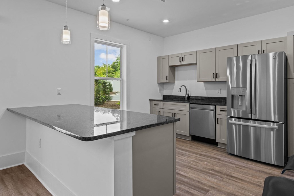 a kitchen with stainless steel appliances and a counter top